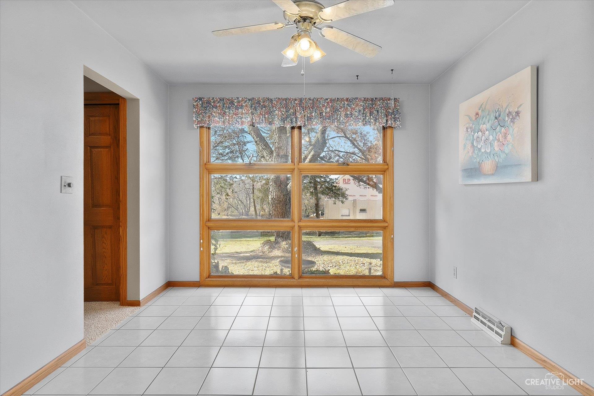 7927 Walnut Street Dixon, IL 61021 - Photo 6 of 33 a view of an empty room with a window