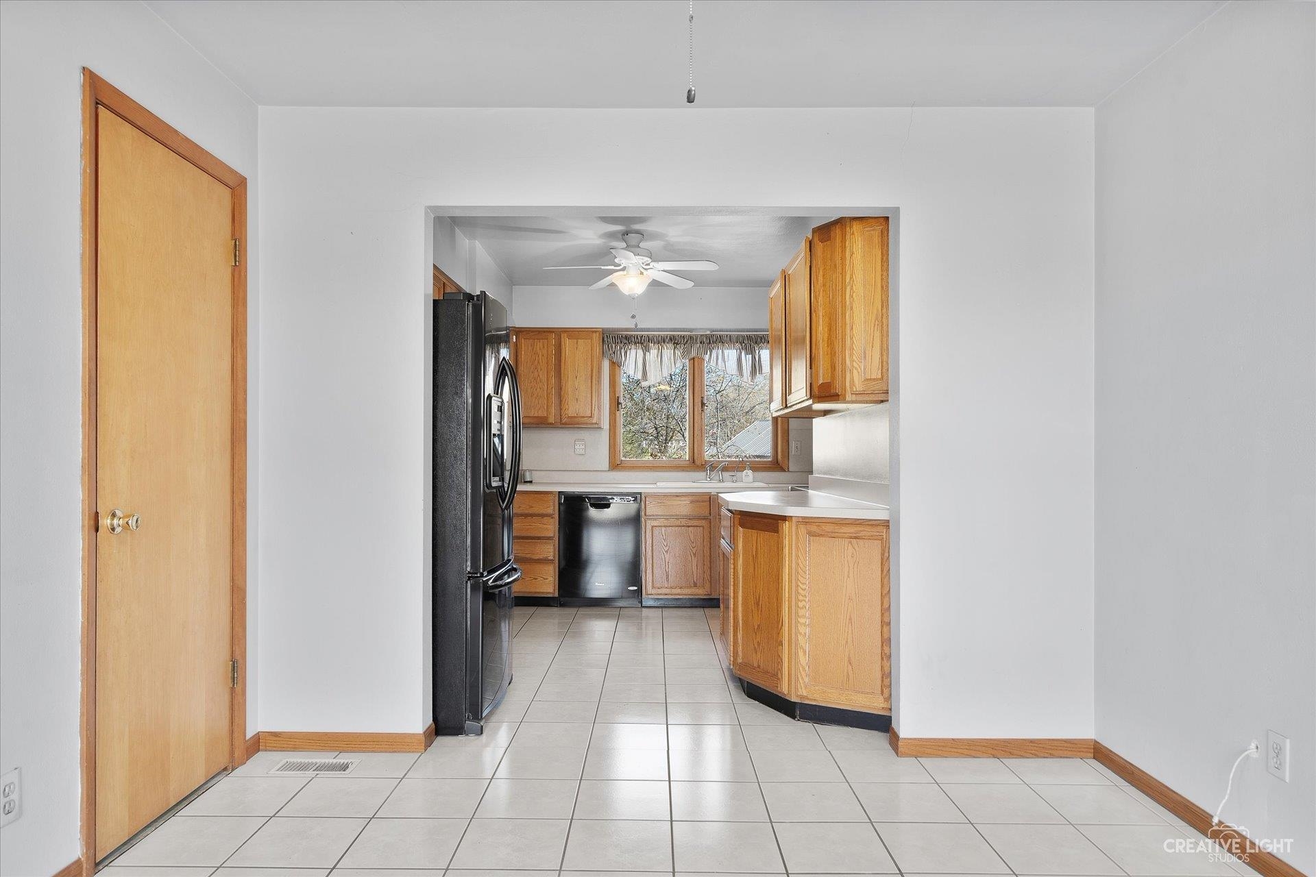 7927 Walnut Street Dixon, IL 61021 - Photo 7 of 33 a kitchen with a counter top space and a window
