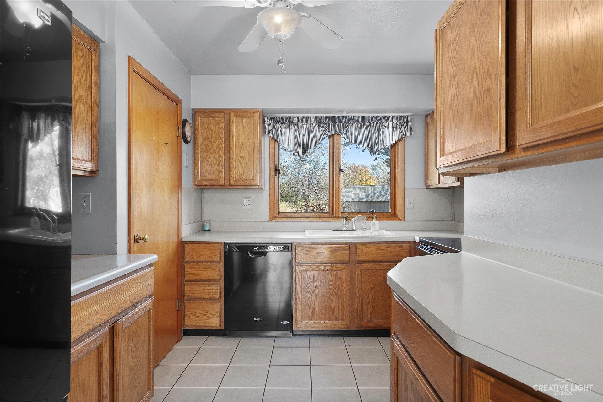 7927 Walnut Street Dixon, IL 61021 - Photo 8 of 33 a kitchen with a sink stove and cabinets