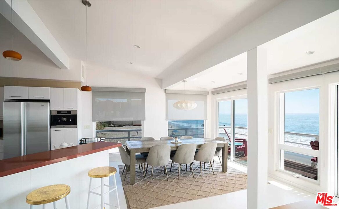 24742 Malibu Road Malibu, CA 90265 - Photo 17 of 18 a large kitchen with a table and chairs