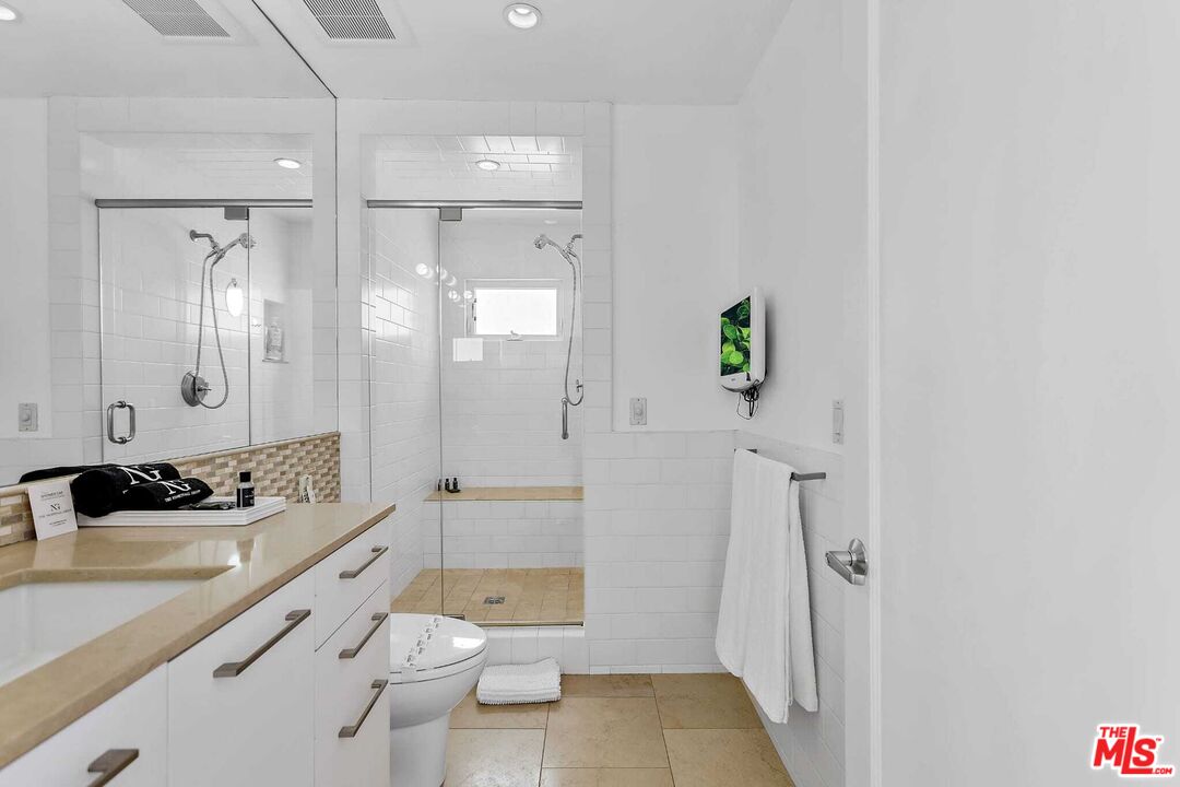 24742 Malibu Road Malibu, CA 90265 - Photo 3 of 18 a bathroom with a sink a toilet and shower