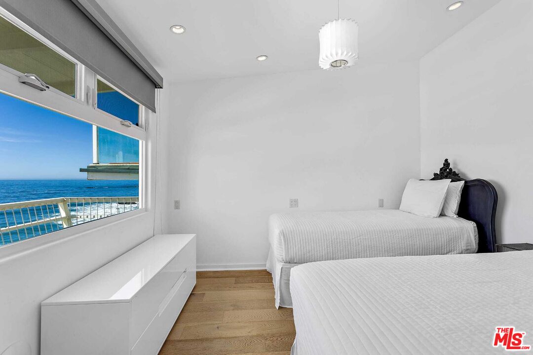 24742 Malibu Road Malibu, CA 90265 - Photo 5 of 18 a room with a bed and a couch