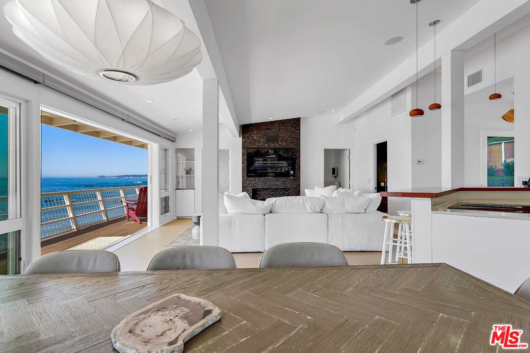 24742 Malibu Road Malibu, CA 90265 - Photo 7 of 18 a living room with furniture and a flat screen tv
