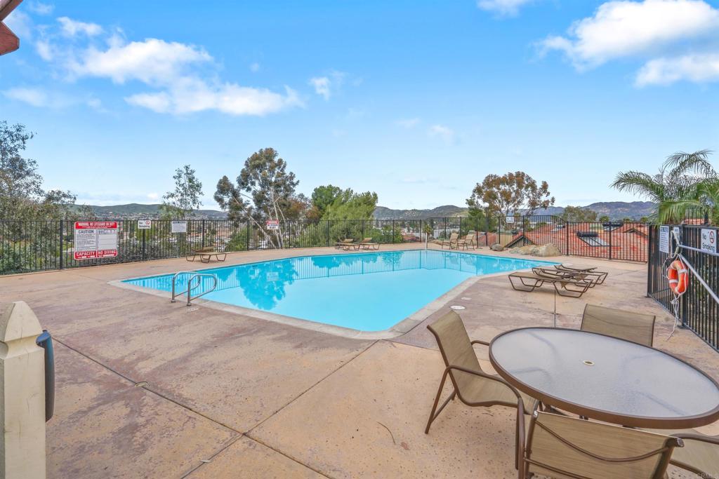 10775 Tamar Terrace, Unit A Santee, CA 92071 - Photo 15 of 38 a view of a swimming pool and a chair