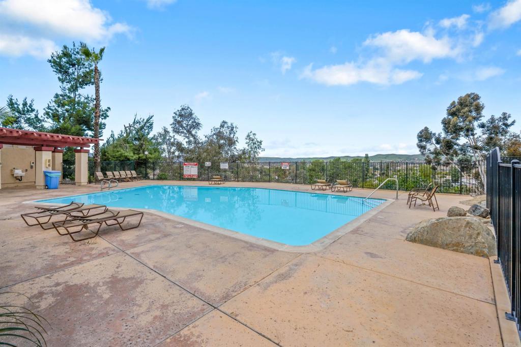 10775 Tamar Terrace, Unit A Santee, CA 92071 - Photo 16 of 38 a view of a swimming pool and lounge chair