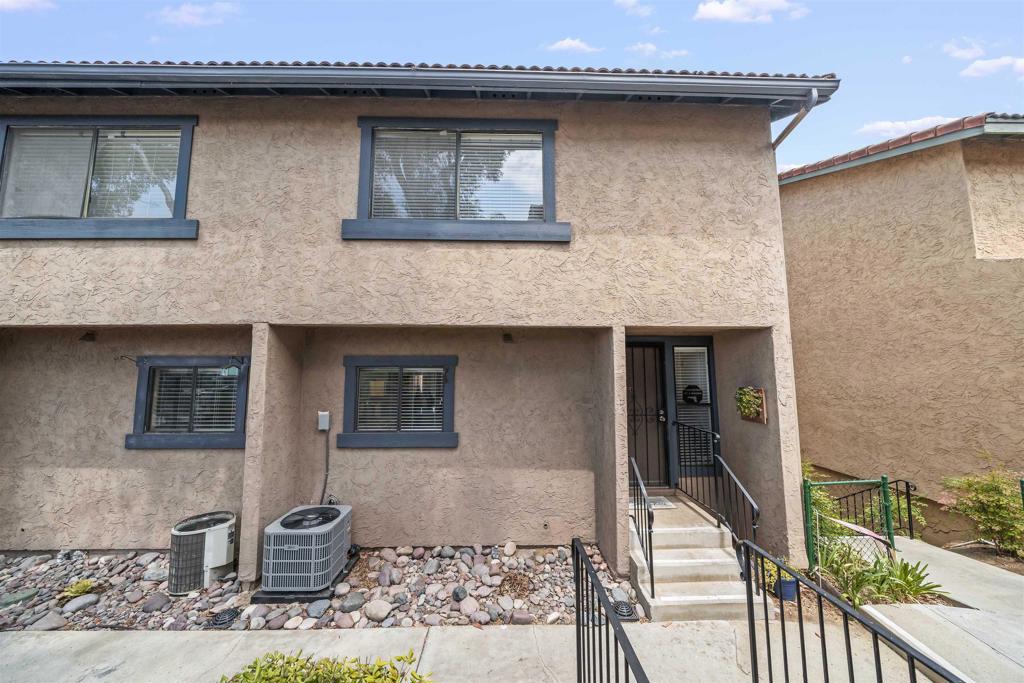 10775 Tamar Terrace, Unit A Santee, CA 92071 - Photo 26 of 38 a front view of a house with garden