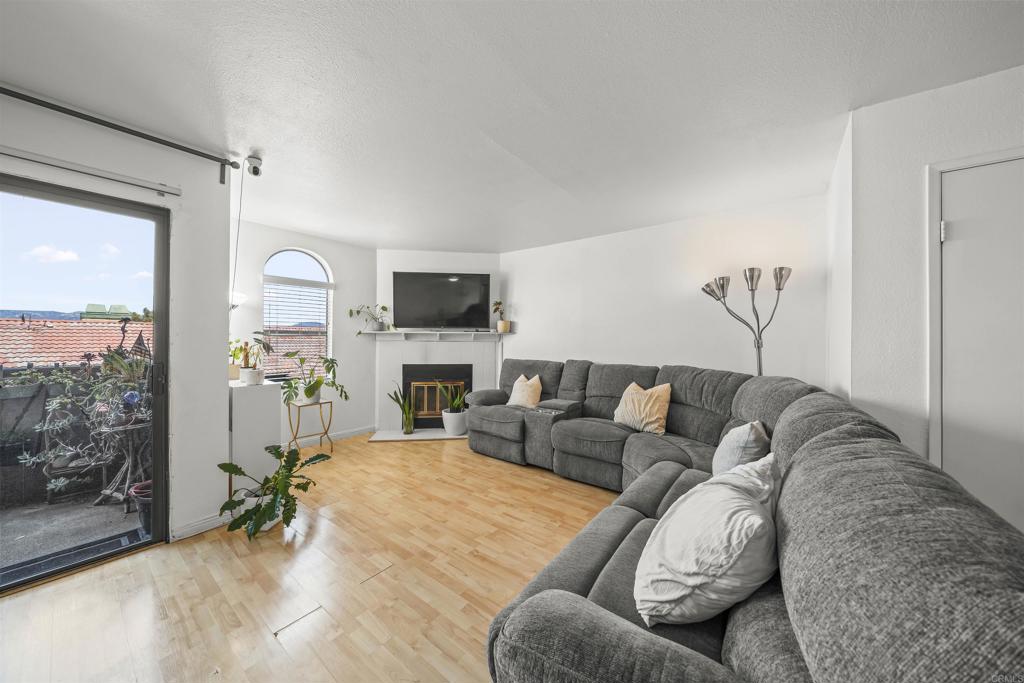 10775 Tamar Terrace, Unit A Santee, CA 92071 - Photo 7 of 38 a living room with furniture and a flat screen tv