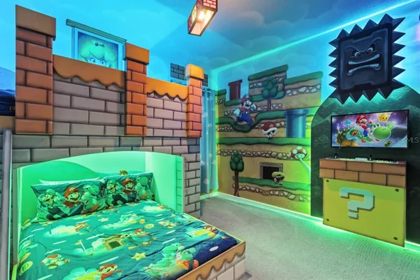 a room with painting on the wall and a potted plant