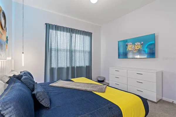 a bedroom with a bed and a dresser