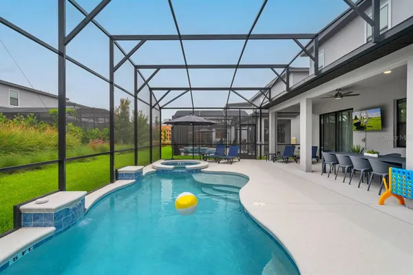 a aerial view of a house with garden space and lake view