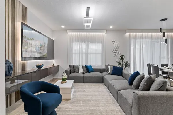 a kitchen with stainless steel appliances kitchen island granite countertop a dining table and chairs