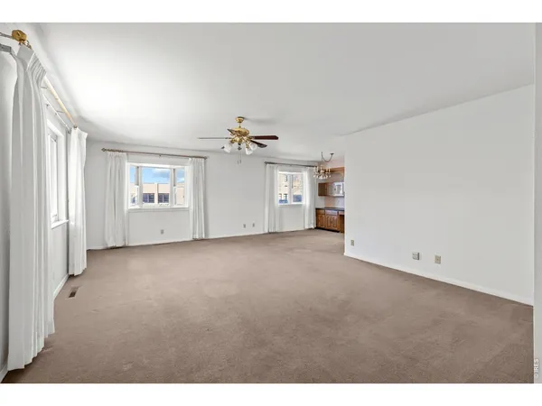 a view of empty room with closet and natural light