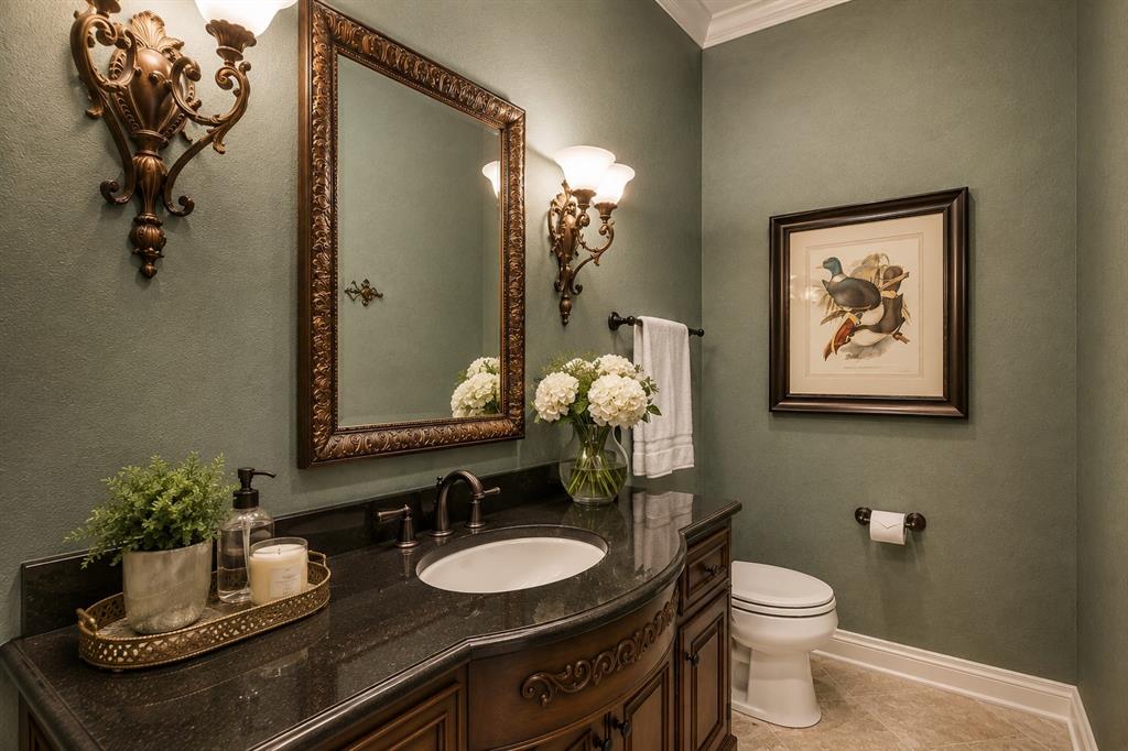 2726 Country Club Road Pantego, TX 76013 - Photo 19 of 23 a bathroom with a toilet sink and mirror