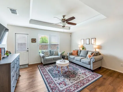 a living room with furniture and a rug