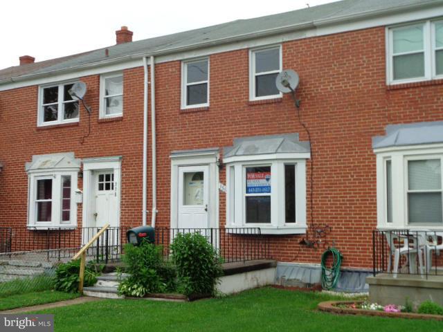 336 Stemmers Run Road Baltimore, MD 21221 - Photo 1 of 13 a front view of a house with garden