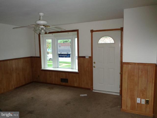 336 Stemmers Run Road Baltimore, MD 21221 - Photo 3 of 13 an empty room that has a window