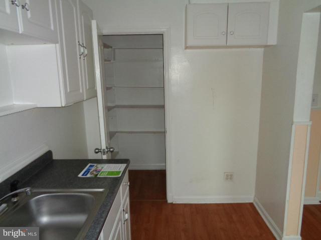 336 Stemmers Run Road Baltimore, MD 21221 - Photo 6 of 13 a kitchen with a sink and cabinets