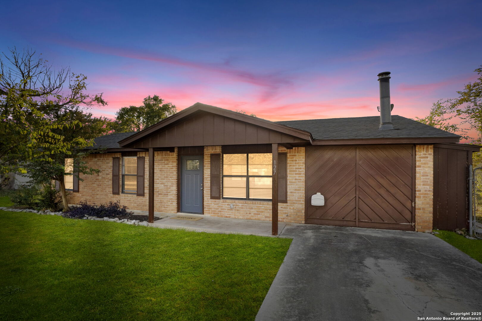a front view of a house with garden