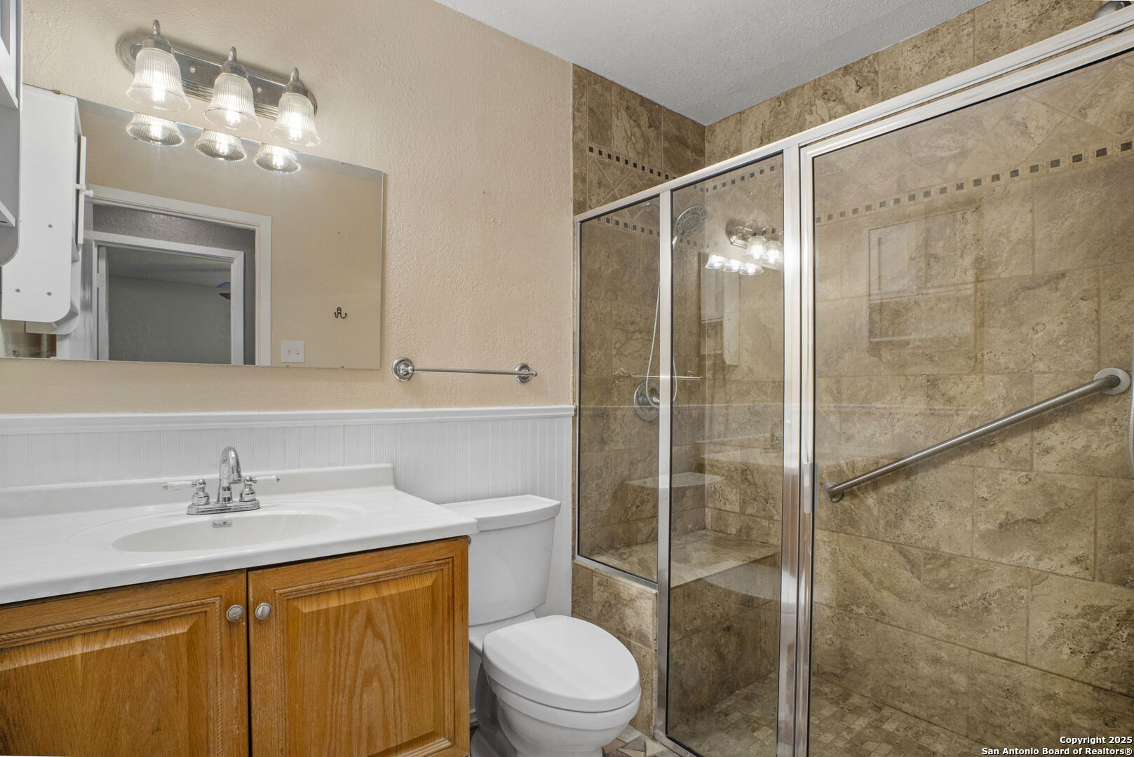 127 Harless Way Center Point, TX 78010 - Photo 15 of 25 a bathroom with a sink vanity mirror and toilet