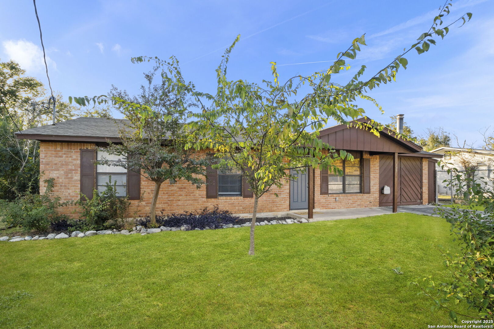 127 Harless Way Center Point, TX 78010 - Photo 2 of 25 a front view of a house with a garden and plants