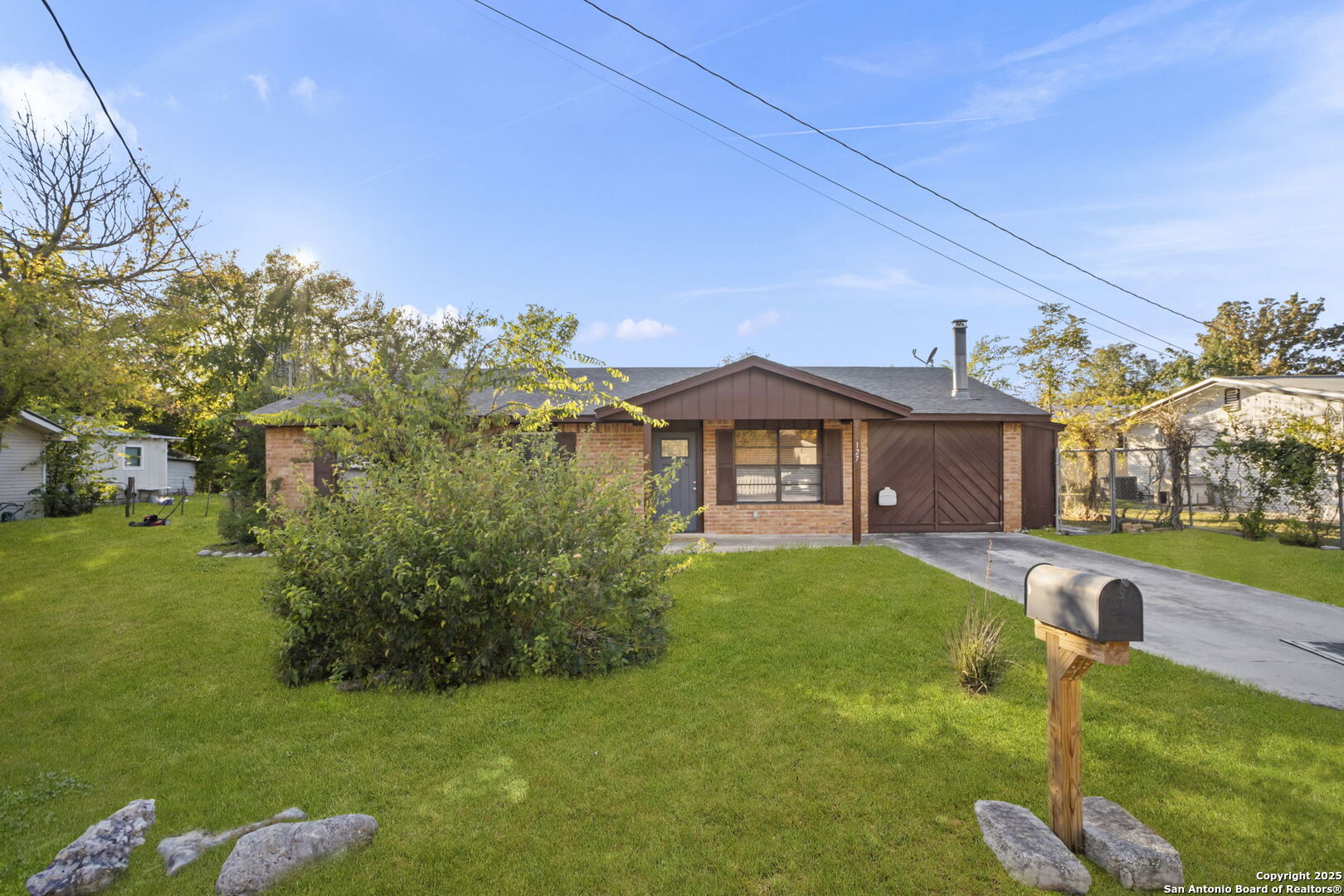 127 Harless Way Center Point, TX 78010 - Photo 3 of 25 a front view of a house with garden