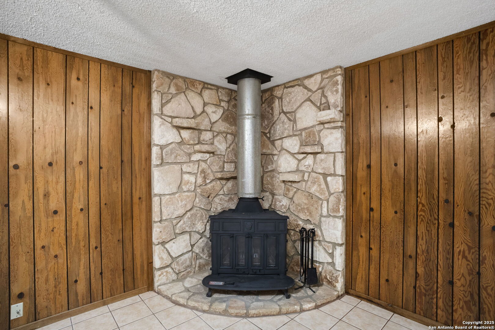 127 Harless Way Center Point, TX 78010 - Photo 7 of 25 a view of entryway with wooden walls