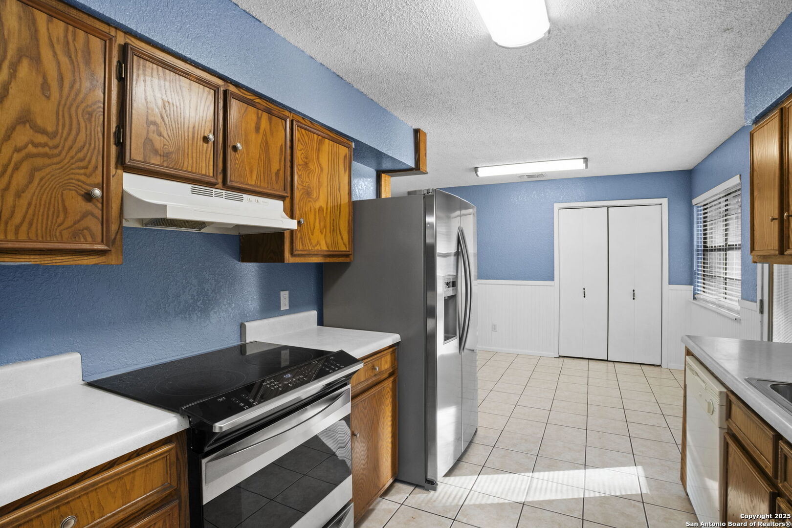 127 Harless Way Center Point, TX 78010 - Photo 10 of 25 a kitchen with stainless steel appliances granite countertop a refrigerator and a stove top oven