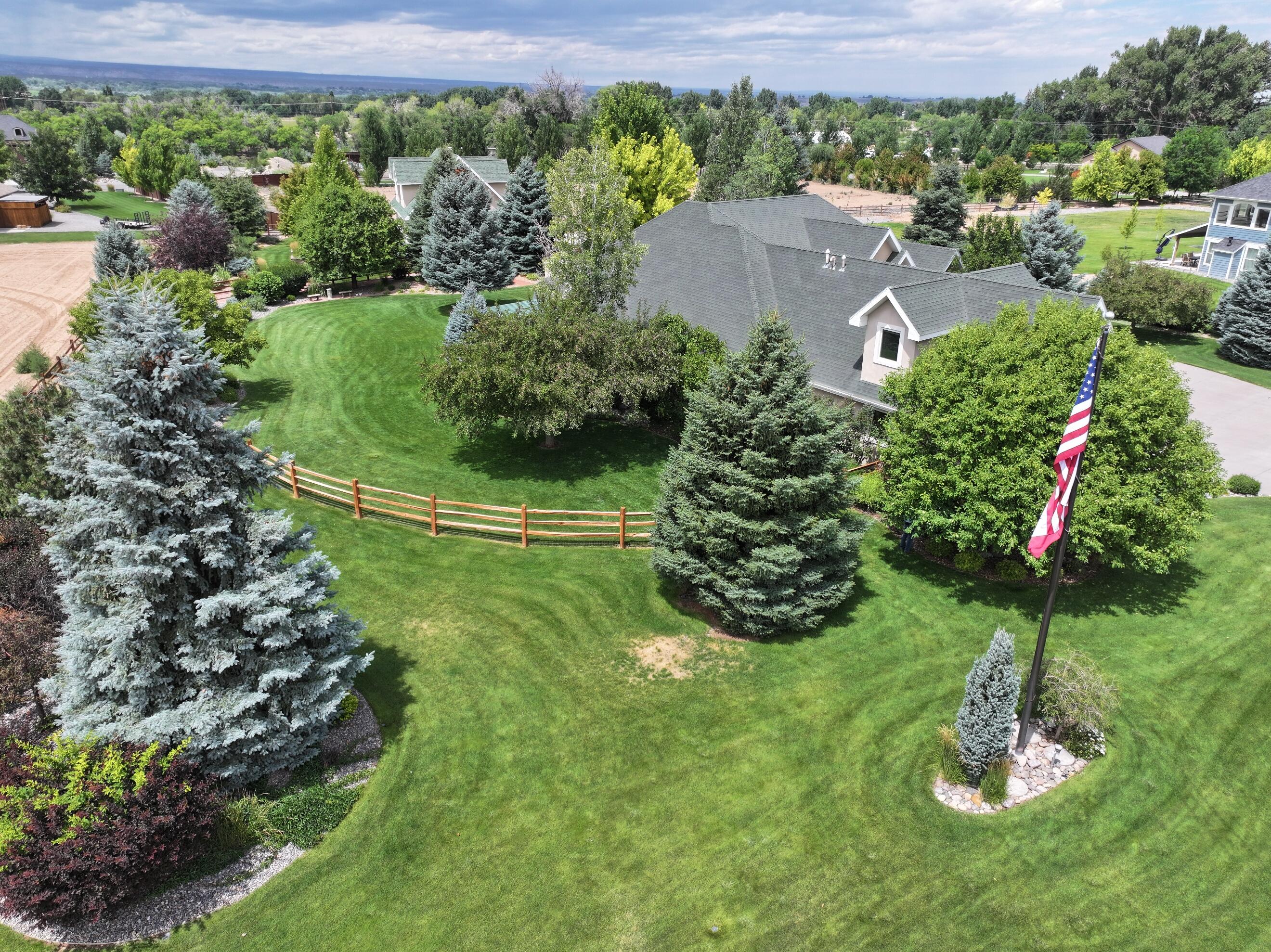 15103 6260th Road Montrose, CO 81403 - Photo 11 of 54 a view of a garden with a house