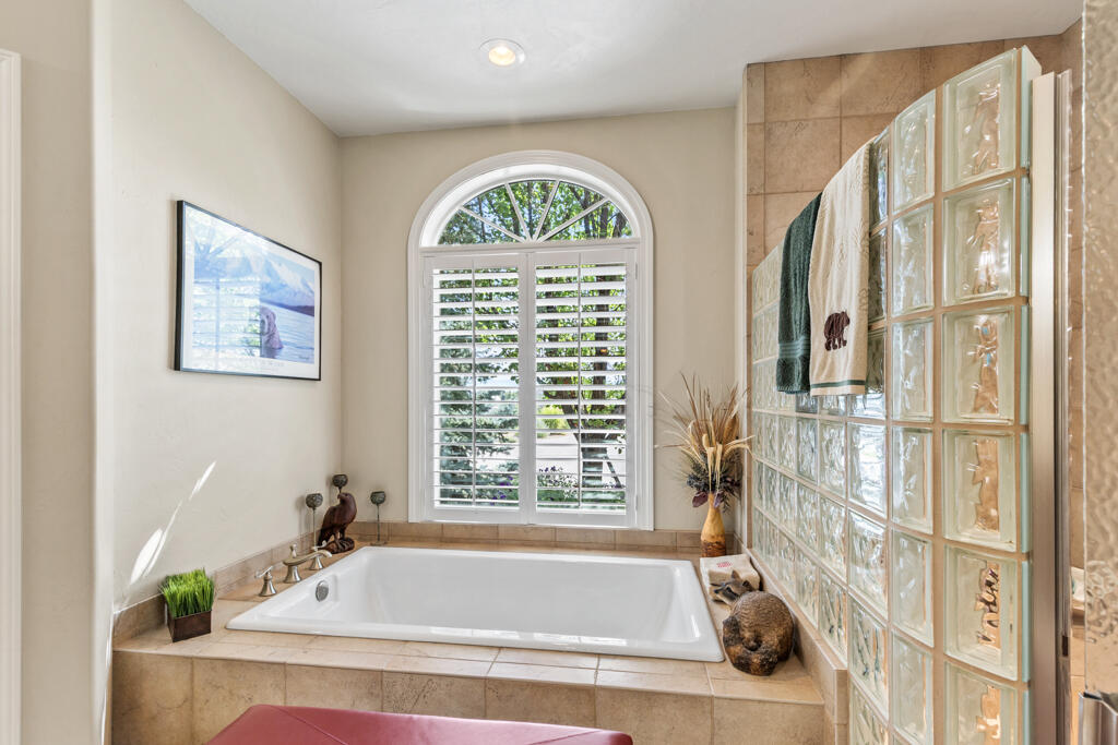 15103 6260th Road Montrose, CO 81403 - Photo 26 of 54 a bath tub sitting next to a window
