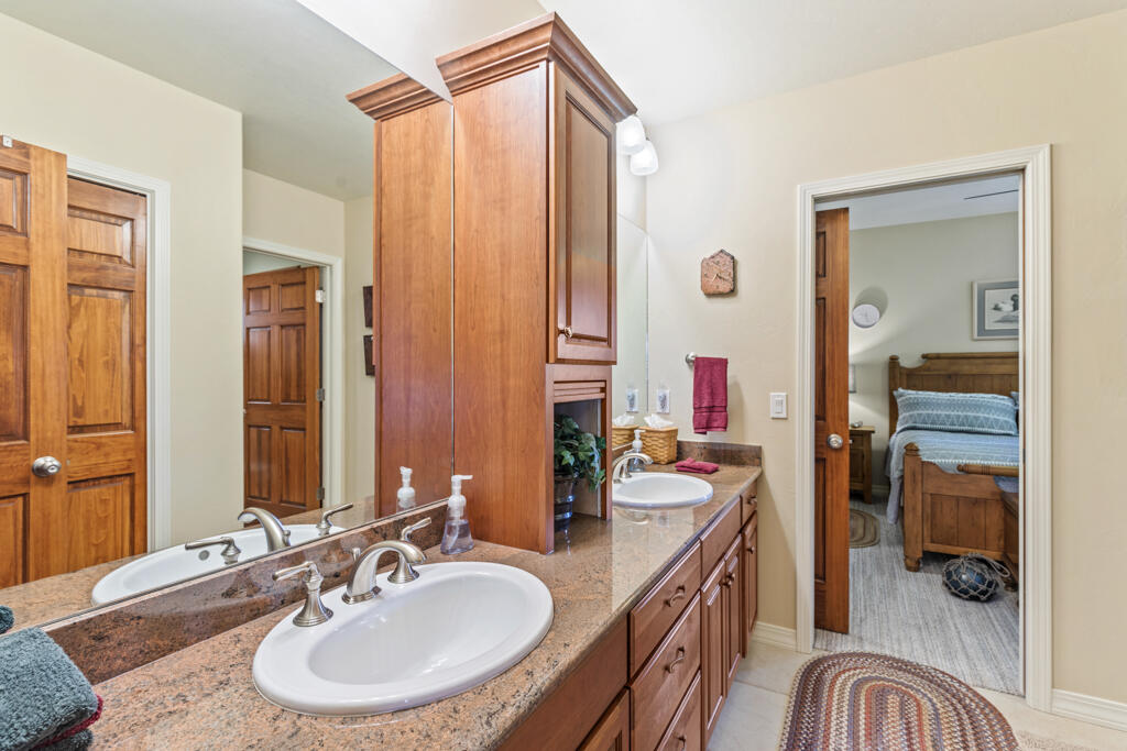 15103 6260th Road Montrose, CO 81403 - Photo 30 of 54 a en suite bathroom with a sink double vanity and a mirror
