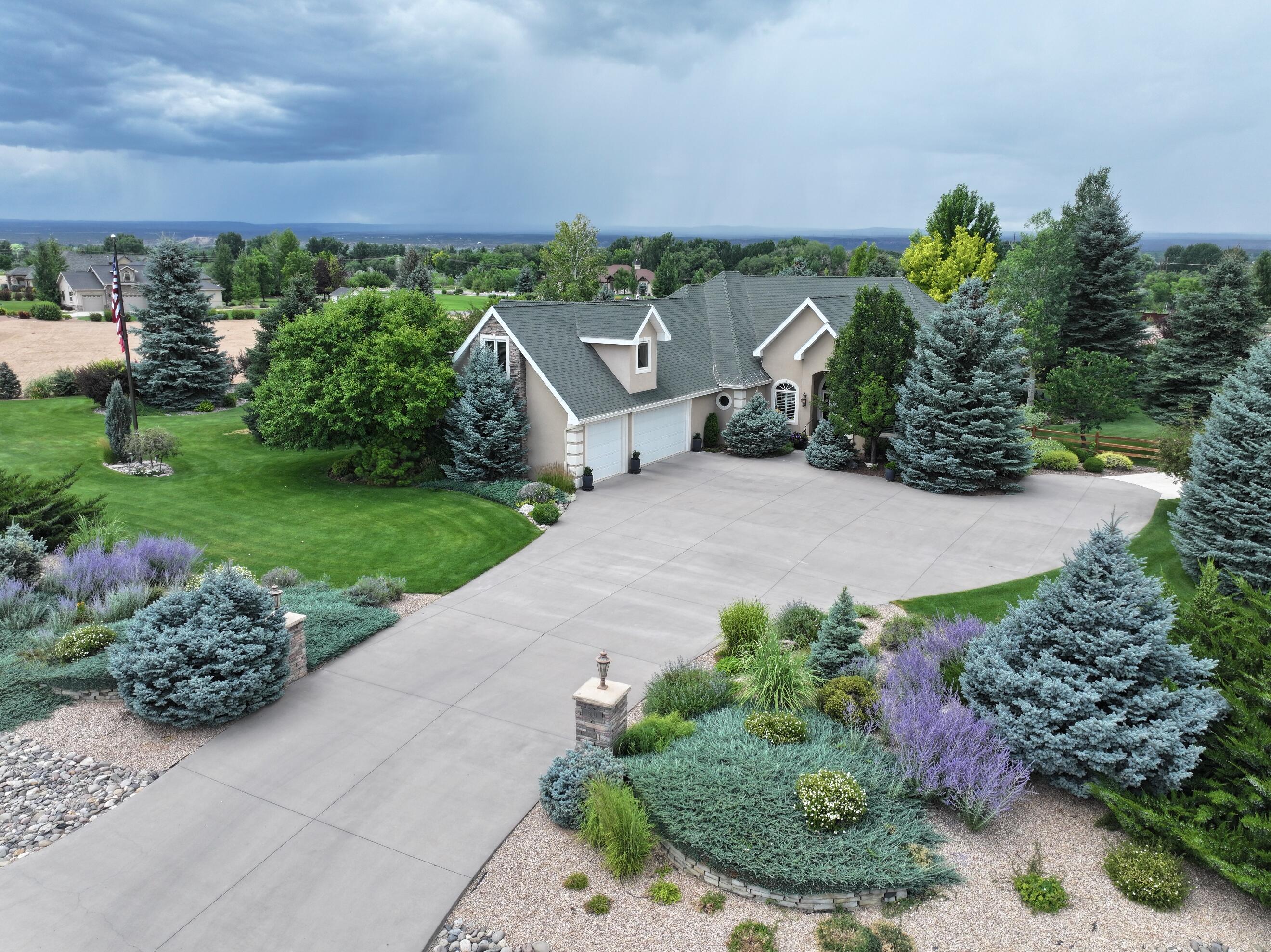 15103 6260th Road Montrose, CO 81403 - Photo 3 of 54 a view of a garden with a pathway