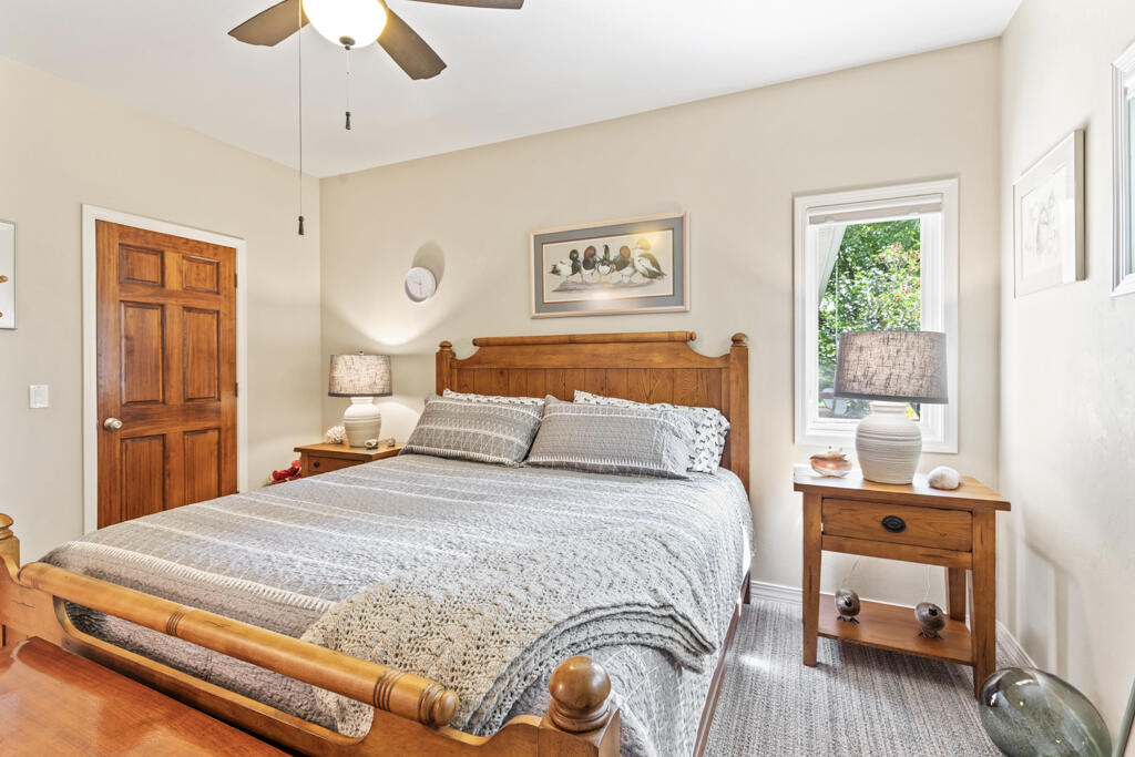 15103 6260th Road Montrose, CO 81403 - Photo 34 of 54 a bedroom with a bed and wooden floor