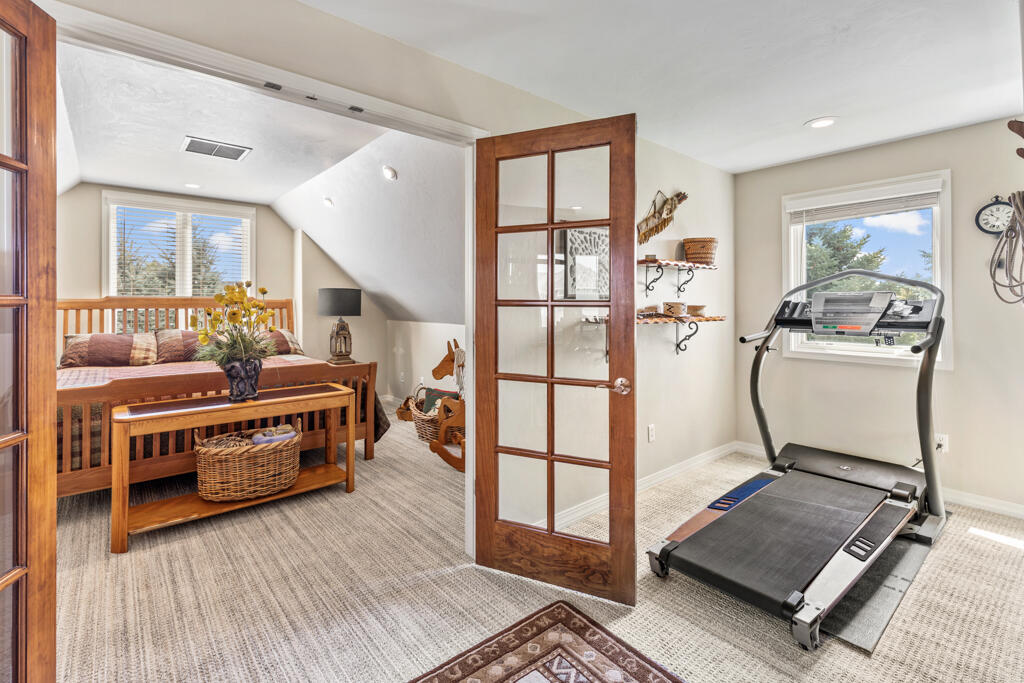 15103 6260th Road Montrose, CO 81403 - Photo 37 of 54 a living room with furniture a flat screen tv and a table