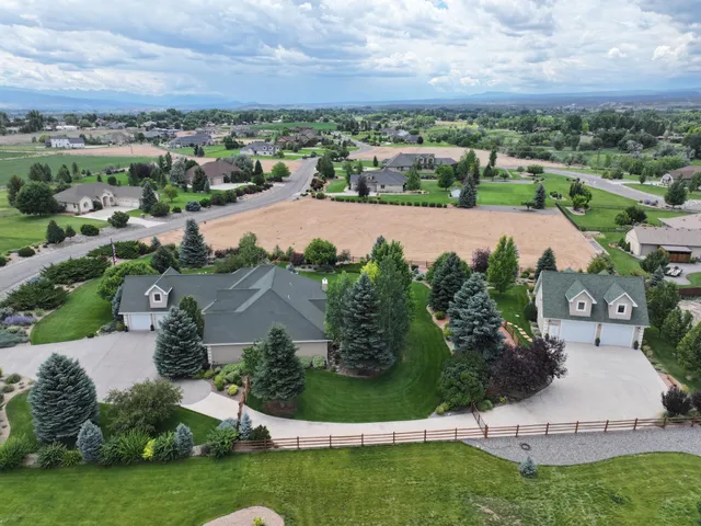 an aerial view of a house with a garden