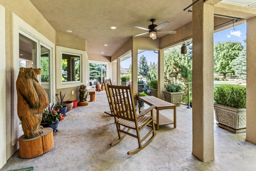 15103 6260th Road Montrose, CO 81403 - Photo 44 of 54 a view of a porch with furniture and floor to ceiling windows