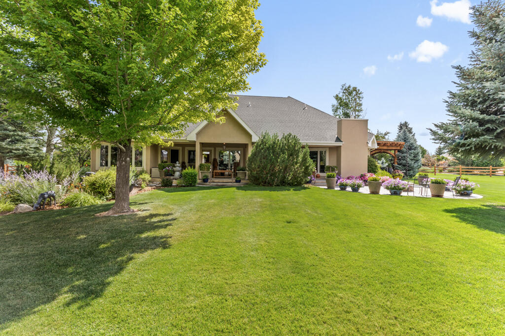 15103 6260th Road Montrose, CO 81403 - Photo 45 of 54 a front view of a house with garden