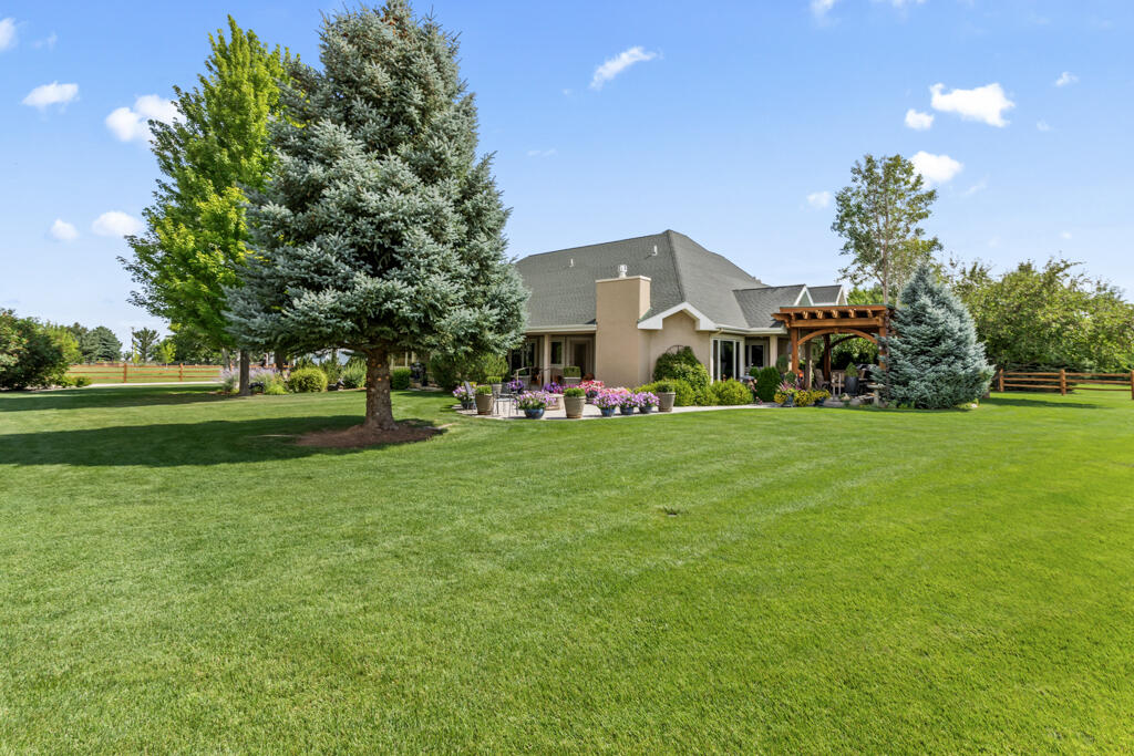 15103 6260th Road Montrose, CO 81403 - Photo 46 of 54 a front view of a house with garden