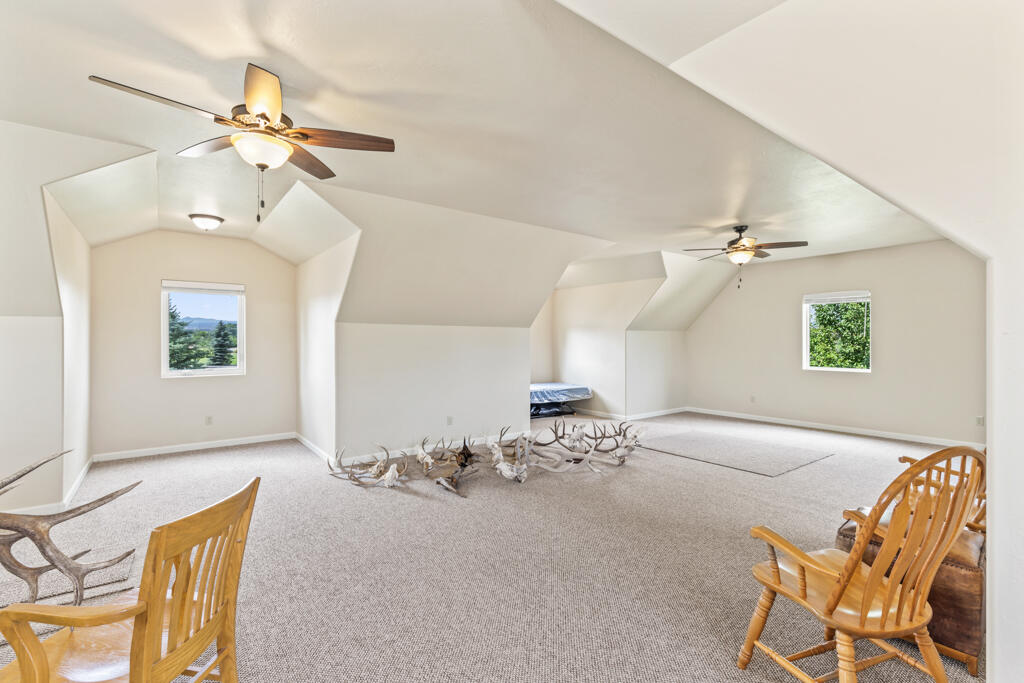 15103 6260th Road Montrose, CO 81403 - Photo 50 of 54 a view of a livingroom and a dining room with a wooden table