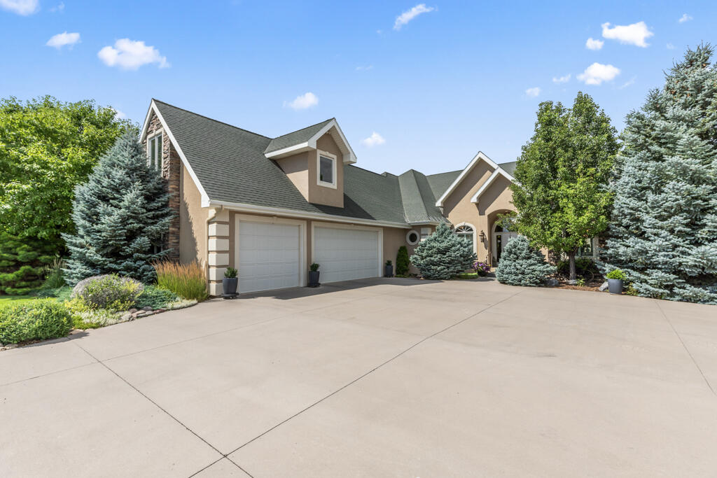 15103 6260th Road Montrose, CO 81403 - Photo 53 of 54 a front view of a house with a yard and garage