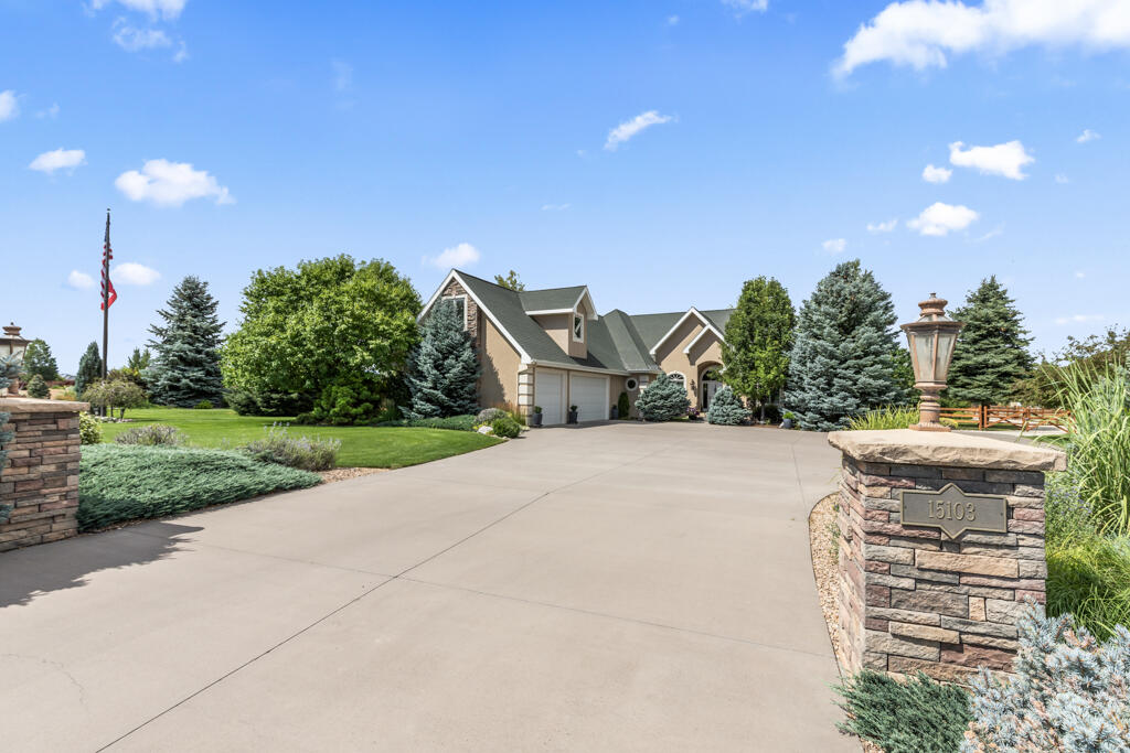 15103 6260th Road Montrose, CO 81403 - Photo 54 of 54 a view of a house with a yard and potted plants