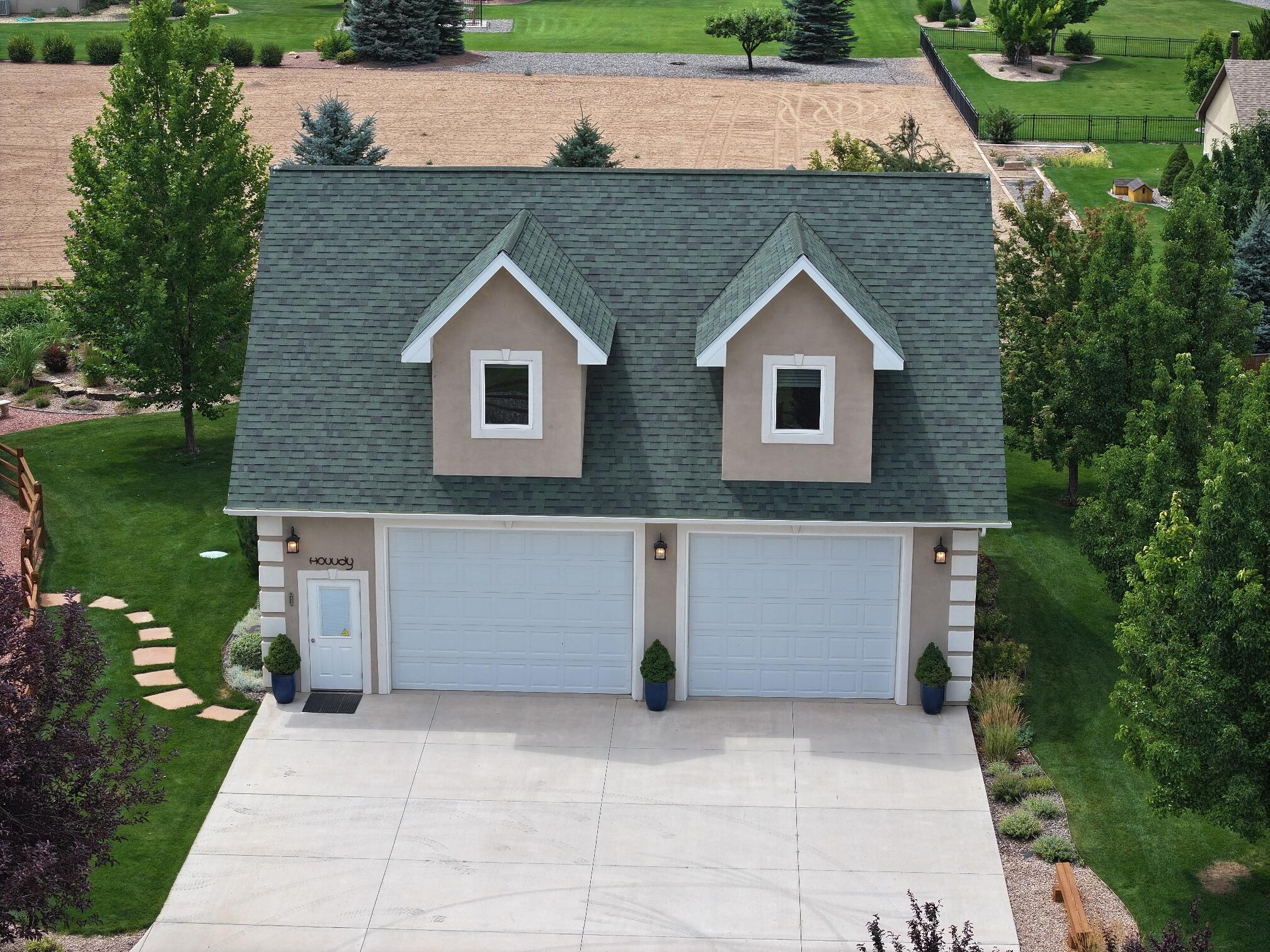 15103 6260th Road Montrose, CO 81403 - Photo 6 of 54 a front view of house with yard and green space