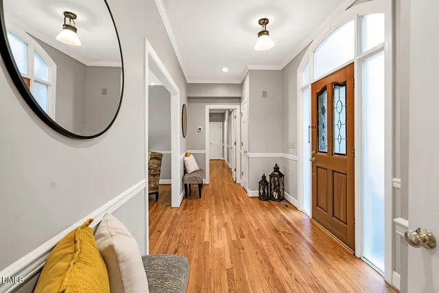 a living room with furniture and large windows