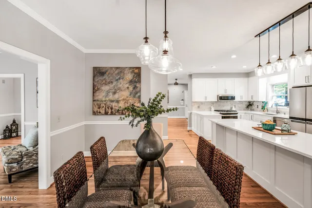 a kitchen with a sink stove top oven and cabinets