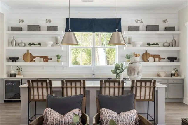 a dining room with furniture a window and wooden floor