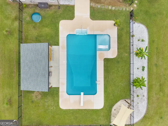 an aerial view of a house with a lake view