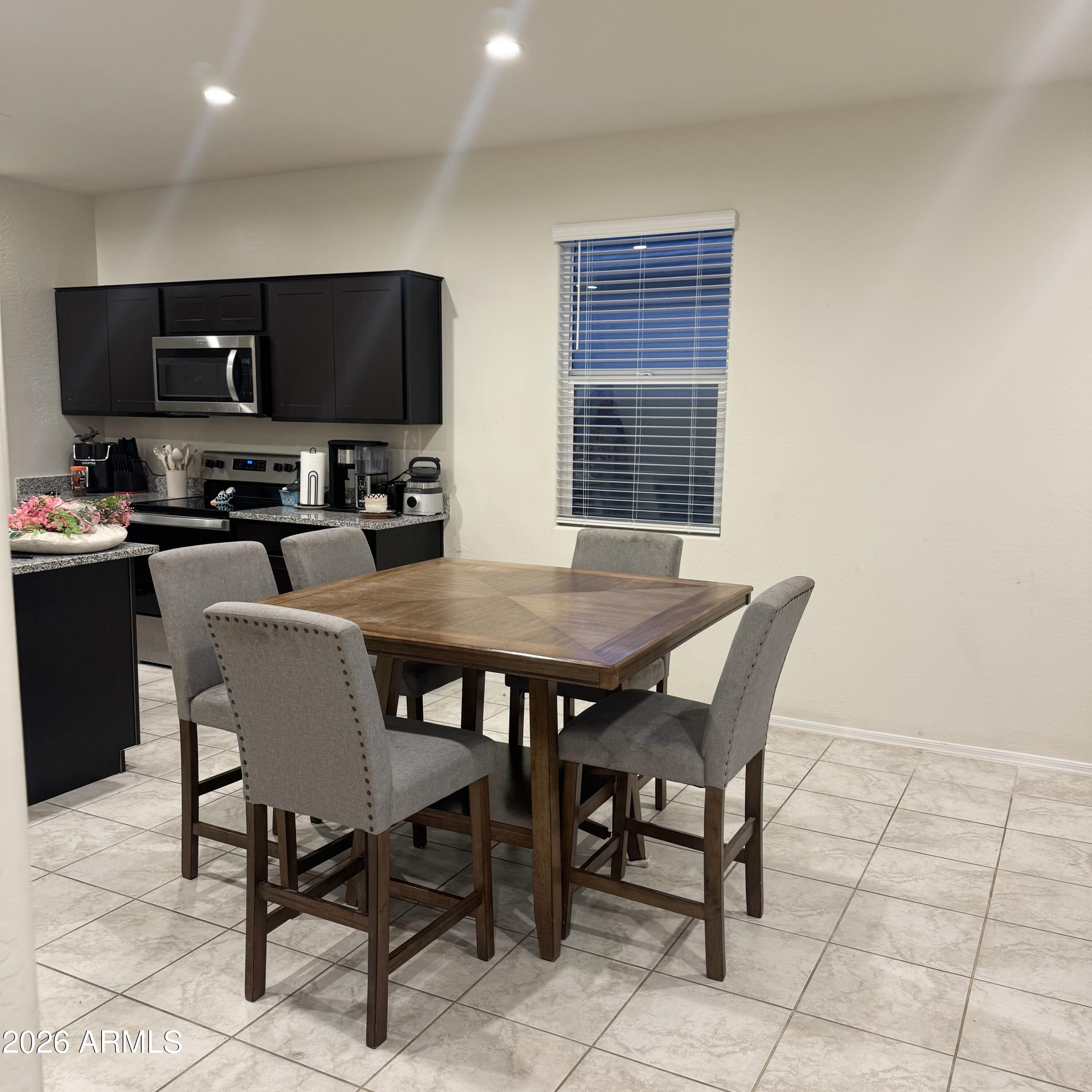 5208 East Emery Road San Tan Valley, AZ 85143 - Photo 11 of 30 a view of a dining room with furniture