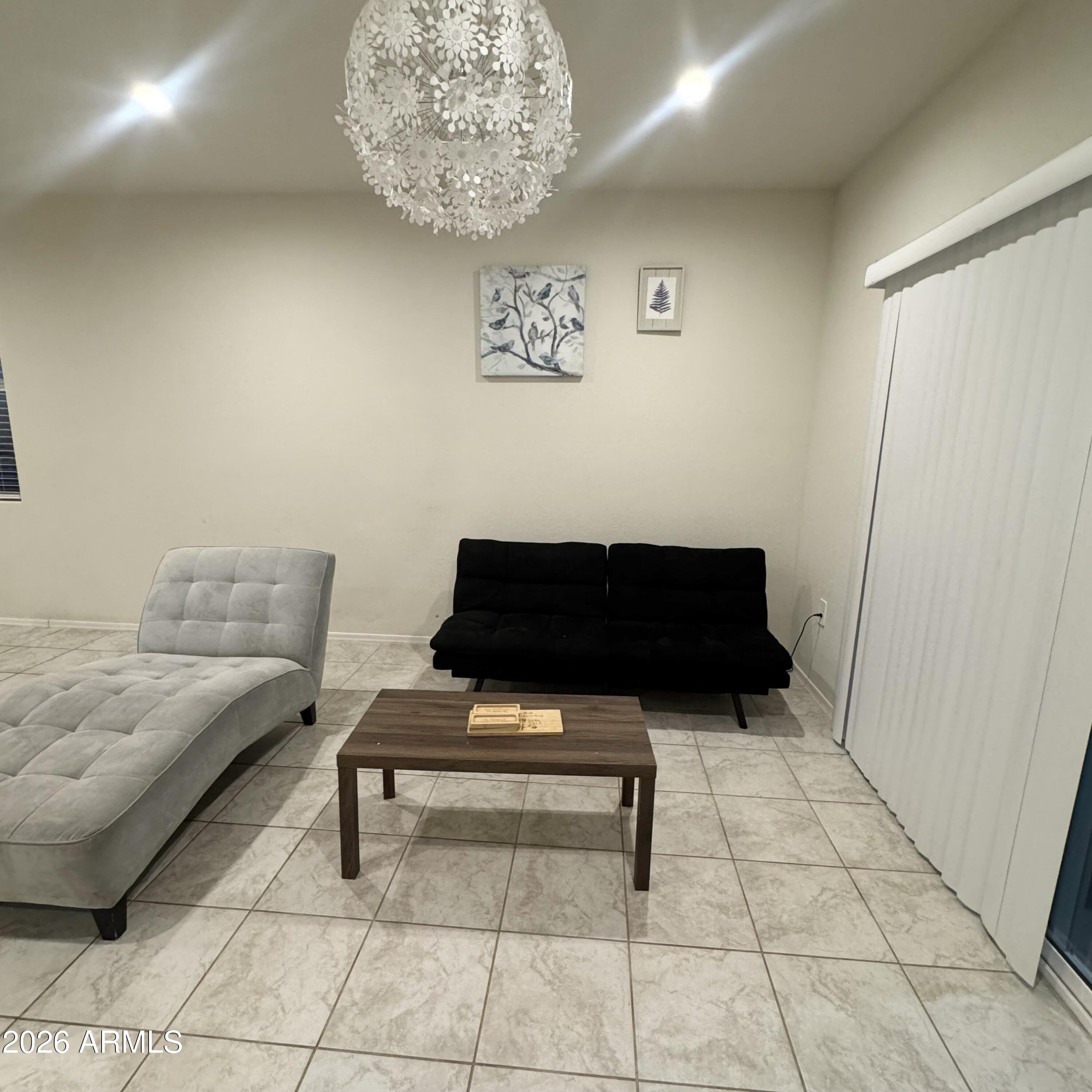 5208 East Emery Road San Tan Valley, AZ 85143 - Photo 16 of 30 a living room with furniture and a table