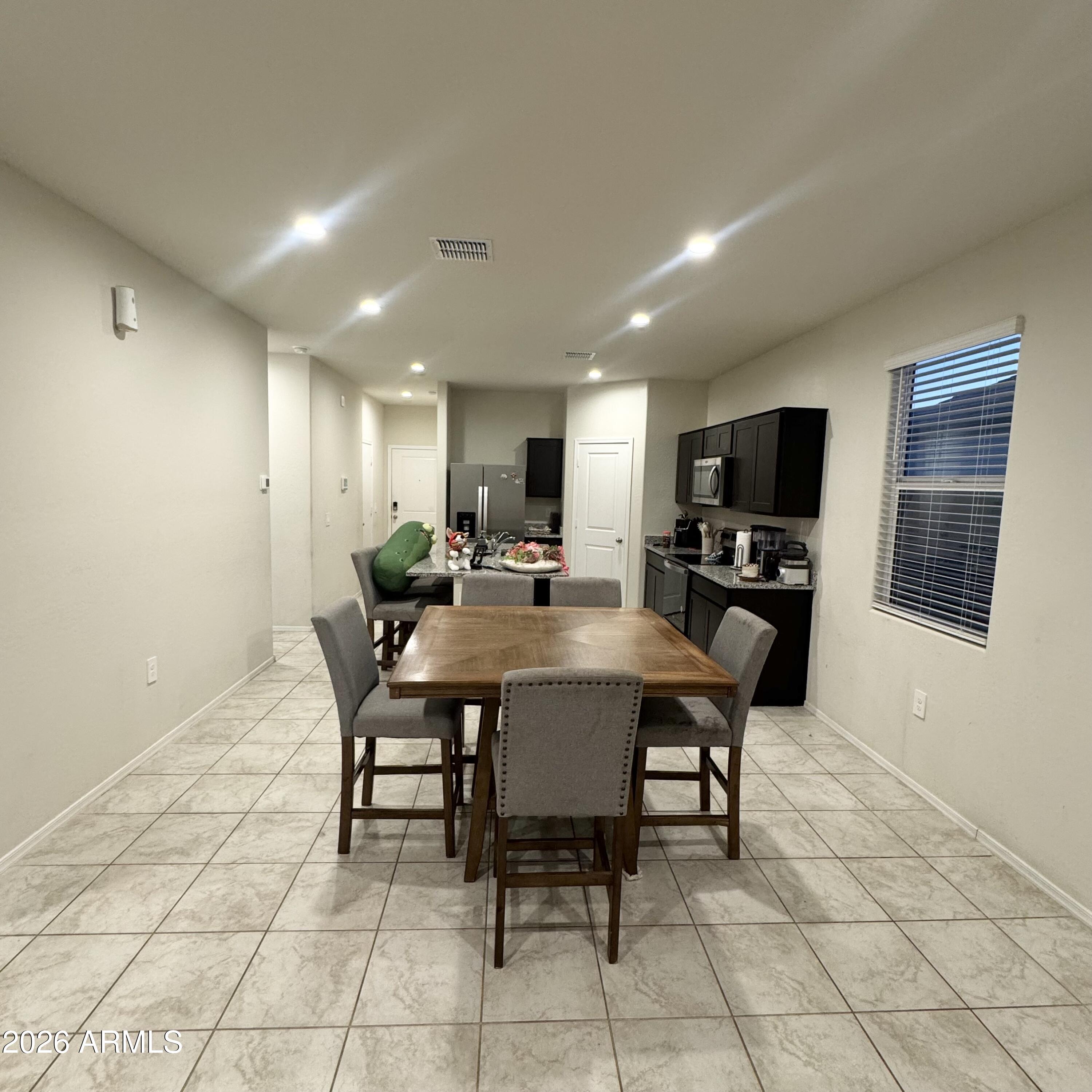 5208 East Emery Road San Tan Valley, AZ 85143 - Photo 17 of 30 a view of a dining room with furniture