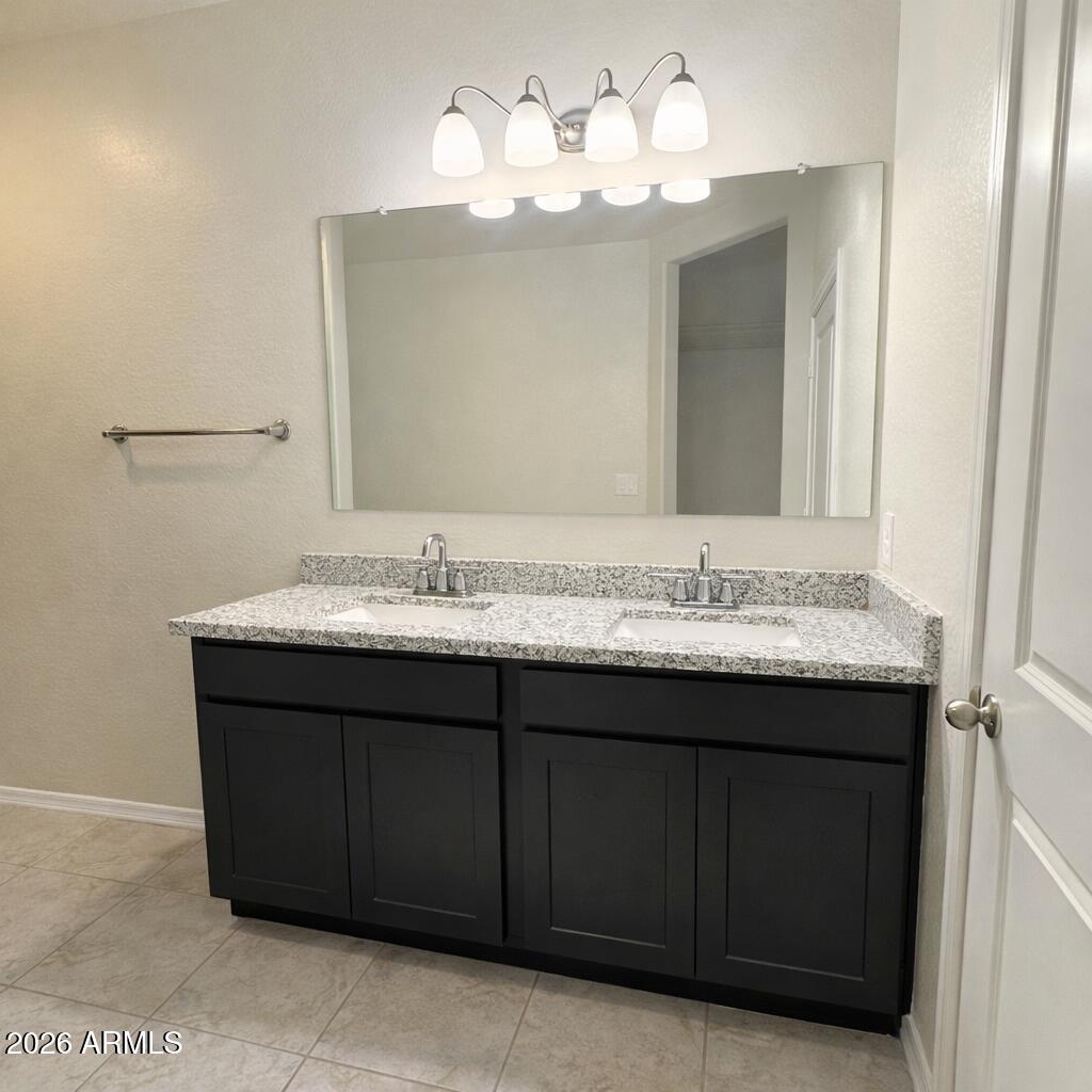 5208 East Emery Road San Tan Valley, AZ 85143 - Photo 18 of 30 a bathroom with a sink vanity and a mirror
