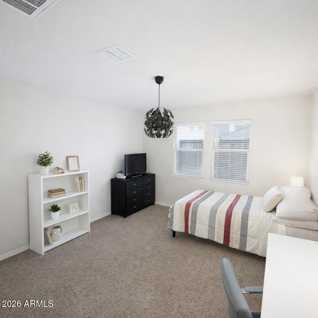 5208 East Emery Road San Tan Valley, AZ 85143 - Photo 19 of 30 a bedroom with a bed and a dresser
